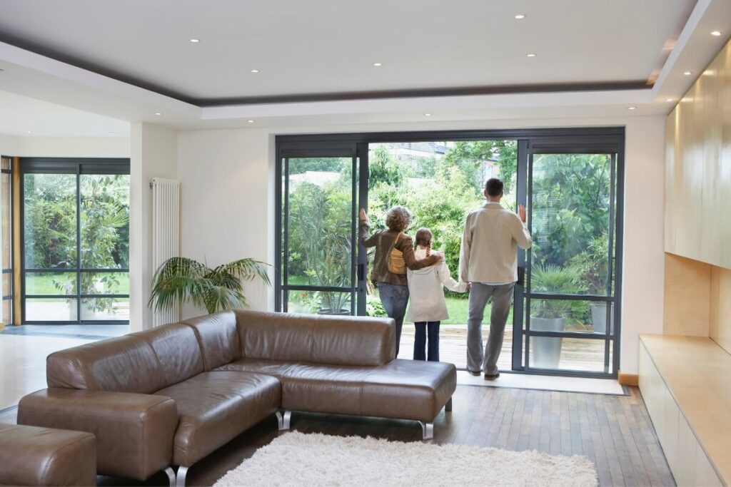 Family Looking Through Patio Door